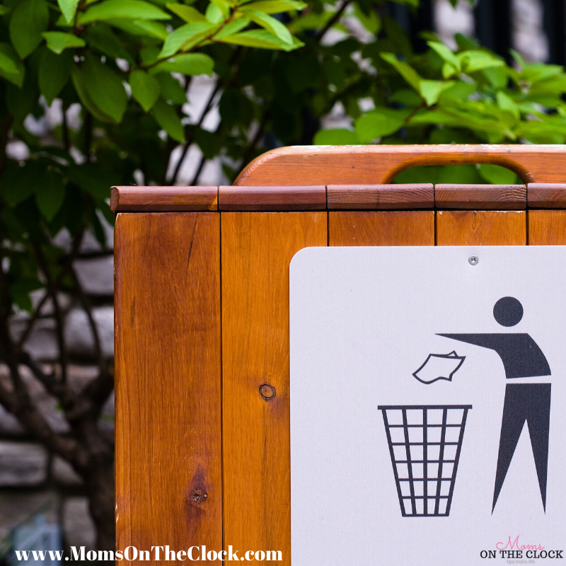 garbage can with picture of guy throwing away trash