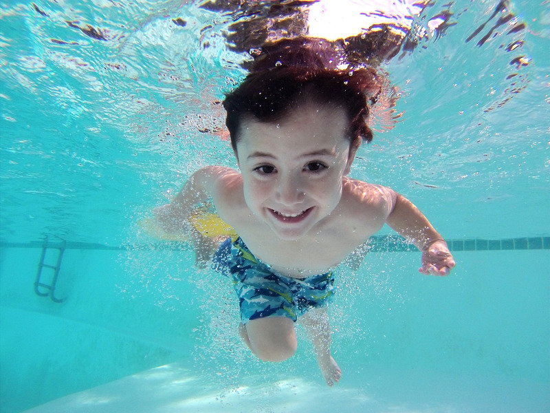 spring break ideas child swimming under water